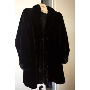 Dyed black sheared mink stroller. Reversible.